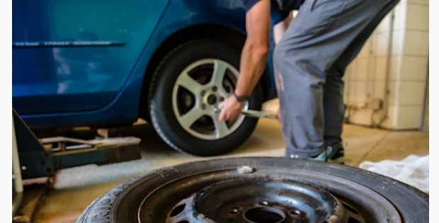 New tire being installed on a vehicle